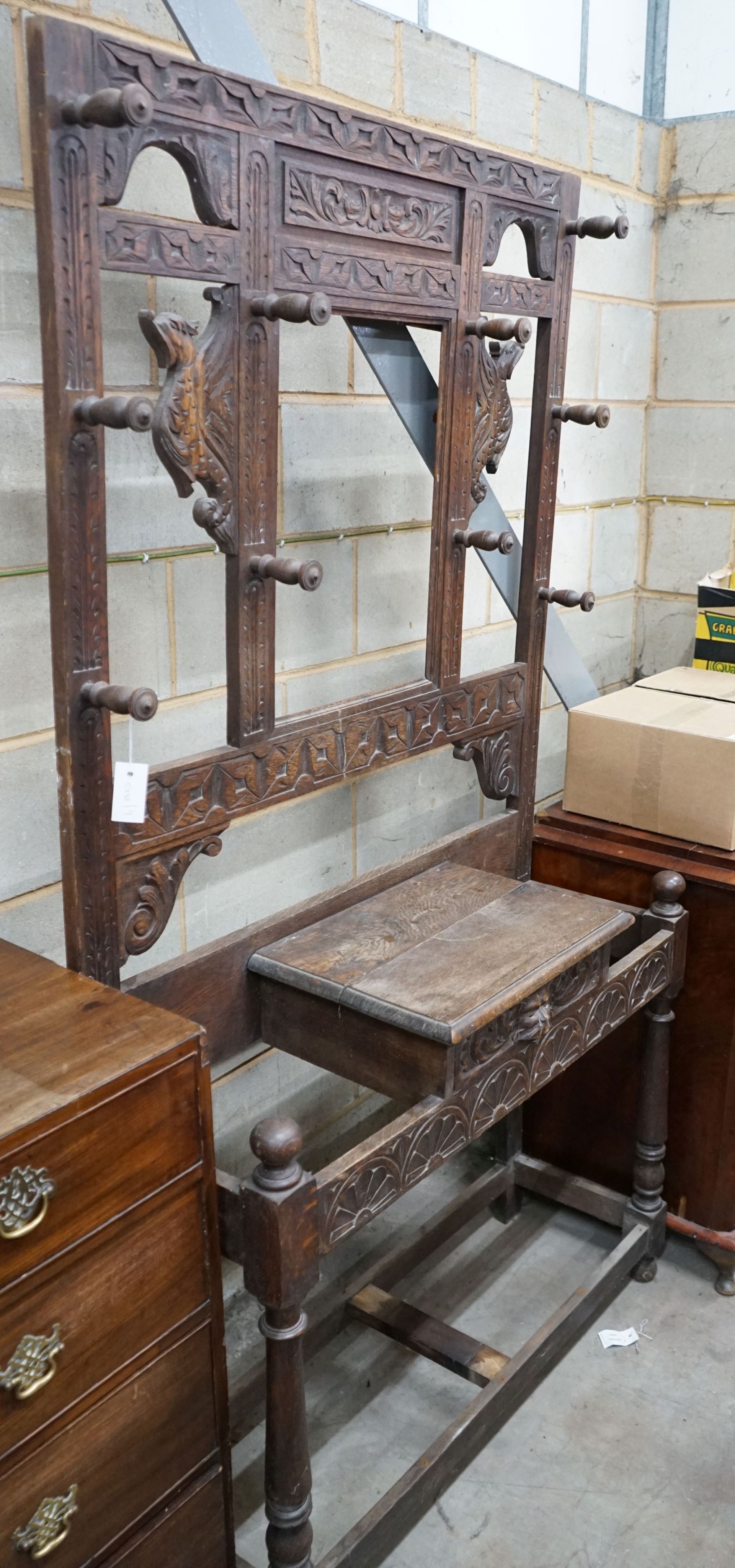 A late 19th century Flemish carved oak hallstand, width 106cm, depth 36cm, height 198cm